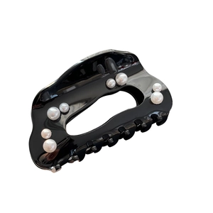 Elegant black cloud-shaped hair claw clip with multiple white pearls on white background