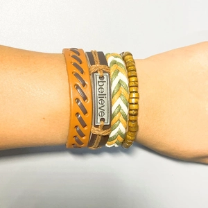 Handmade multilayer leather bracelet set with wooden beads and believe metal plate on wrist