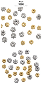 Macro detail of 18k gold and silver snowflake spacer beads for DIY jewelry making