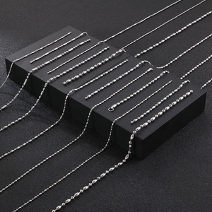 Polished stainless steel ball and bamboo bead chains displayed on a premium black background