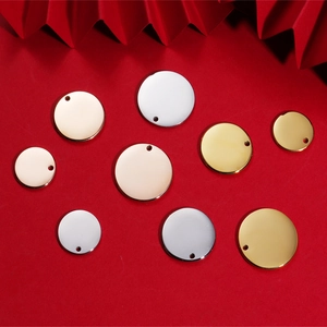 Detailed view of square and round stainless steel pendants in gold, silver, and rose gold