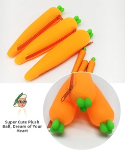 Close-up of carrot-shaped silicone pencil case with green leaves and zipper detail