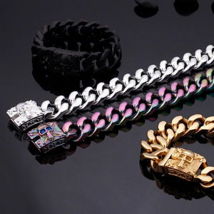 Detail of punk cuban link bracelets in black silver gold and rainbow with skull clasp