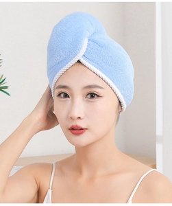 Close-up of light blue double-layered microfiber hair towel wrap on woman's head