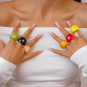 Minimalist colorful resin square rings shown on model in various vibrant polished colors