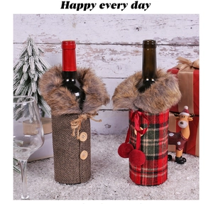Detail of Christmas wine bottle covers with faux fur collars and festive plaid patterns