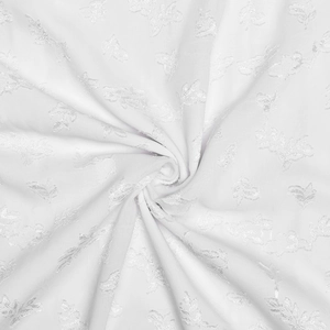 Macro detail of white floral embroidery fabric with 3D leaf patterns for maxi dress