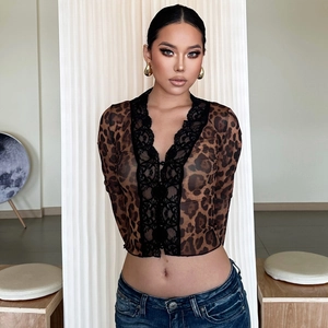 Close-up of leopard print mesh top with black lace trim and semi-transparent texture