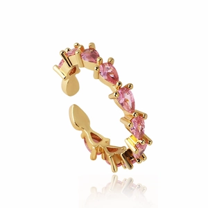 Detail of pink pear-cut zircon stone and gold plated prong setting on an open ring