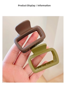 Detail showing two matte rectangular hair claws in coffee and olive green colors