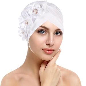 Elegant white pleated turban hat with three 3D fabric flowers and pearl accents