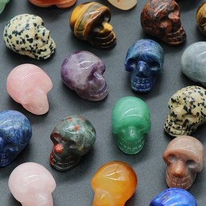 Polished 1-inch natural crystal skull carvings in various colorful quartz and agate stones
