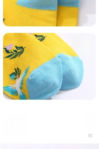 Detailed close-up showing flat toe seam and vibrant blue bird pattern on cotton socks