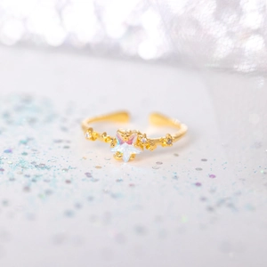 Adjustable 18K gold star ring with iridescent opal stone and sparkling accents