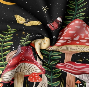 Detail of mushroom and butterfly print fabric with vibrant colors and smooth texture