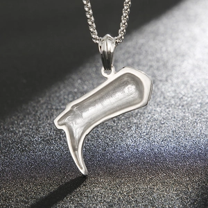 Star pattern boot pendant in titanium steel with a matte silver finish on a link chain