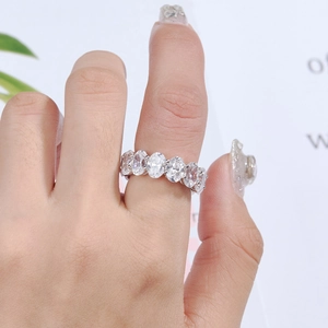 Close-up of 925 sterling silver band featuring oval-cut cubic zirconia in a prong setting