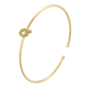 Detail shot of golden letter Q bangle featuring sparkling white zircon micro-inlay