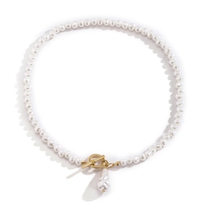 Detailed macro view of baroque pearl necklace with golden OT clasp and unique pendant