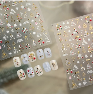Detail of 3D embossed Christmas nail stickers with gold trees and snowflakes, model TL-413