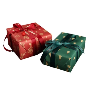 Christmas themed kraft gift box set with snowflake patterns and satin ribbons in red and green