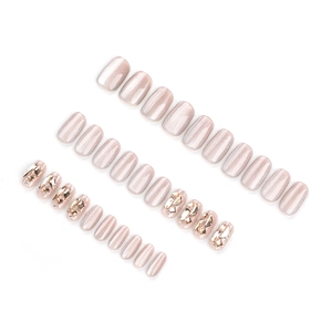 Short square nude pink cat eye press-on nails set with gold geometric rhinestones