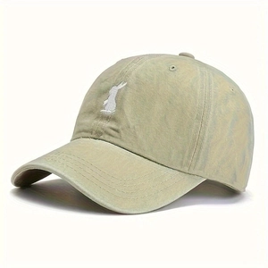 Detail of white rabbit embroidery on a khaki washed cotton vintage baseball cap