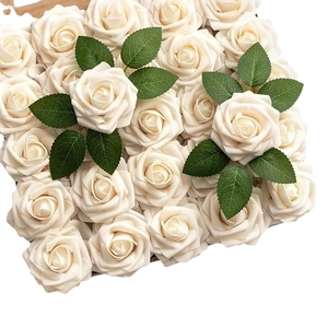 Creamy white artificial PE roses bridal bouquet with green leaves in a top-down view