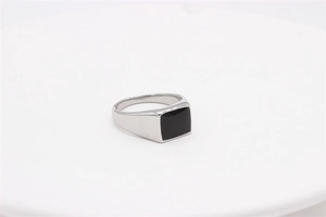 Detailed view of vintage silver steel ring featuring a sleek rectangular black gemstone inlay