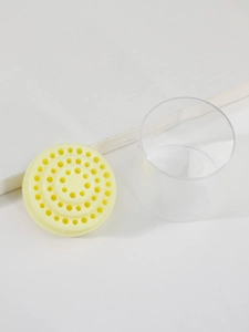 Draufsicht auf gelben Nagelschleifer-Halter mit transparentem Zylinder-Gehäuse