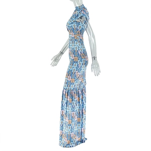 Detail of slim-fit maxi dress featuring vintage blue and orange geometric patterns