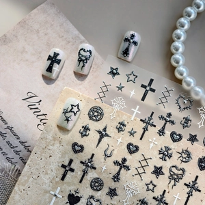 Gothic nail art stickers with cross and star patterns on vintage background