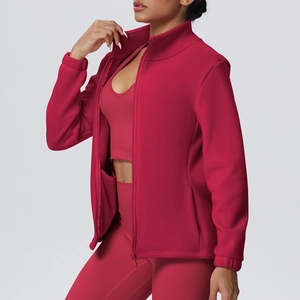 Detail view of red zip-up sports jacket with stand-up collar and slim fit tailoring