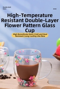 Close-up of double-wall borosilicate glass mug with pink and blue dried flower petals