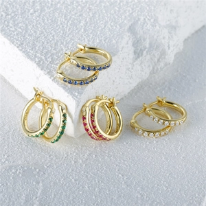 Close-up of S925 sterling silver hoop earrings set with colorful gemstone crystals