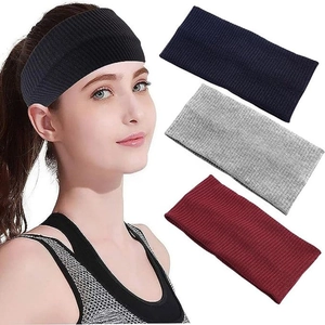 Detail of four ribbed knit headbands in black, navy, grey, and burgundy colors