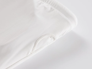 Detail of thumb hole design on the sleeve cuff of white high-elastic tube top crop