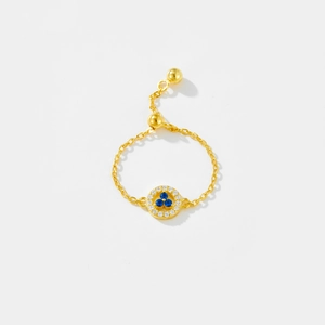 Detailed view of adjustable gold chain ring featuring blue stones and white zircon accents