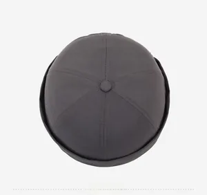 Top view of charcoal gray docker cap showing six-panel stitching and twill fabric detail