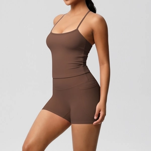Detail of high-stretch brown yoga set with side pockets on high-waisted gym shorts