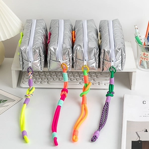 Silver quilted pencil cases with heart patterns and colorful woven rope zipper pulls