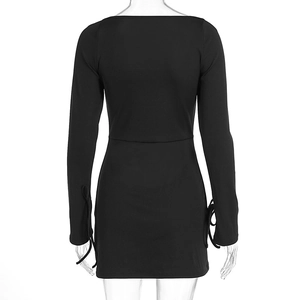 Detail view of long sleeves with adjustable tie-up ribbons on black mini dress