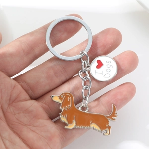 Detailed close-up of a metal dachshund keychain with an I Love Dogs round charm