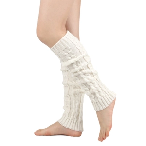 Detailed knit texture of thick cable-knit leg warmers in cream white for winter