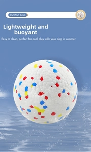 Floating bouncy pet ball with colorful honeycomb texture splashing in water
