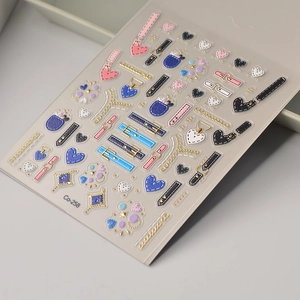Detail of Co-258 nail art sticker with golden punk chain and denim strap motifs