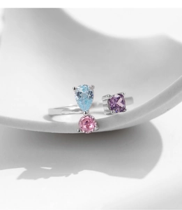 Detailed close-up of S925 silver ring featuring blue pear, pink round and purple square crystals