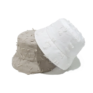Women cotton bucket hat with distressed frayed edges in white and beige summer styles