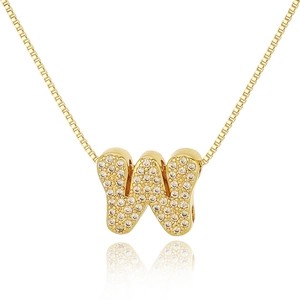Close-up of golden letter W pendant with white zircon stones on a box chain