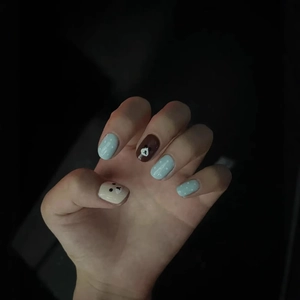 Cute cartoon bear press-on nails set with light blue polka dots and cream white finish
